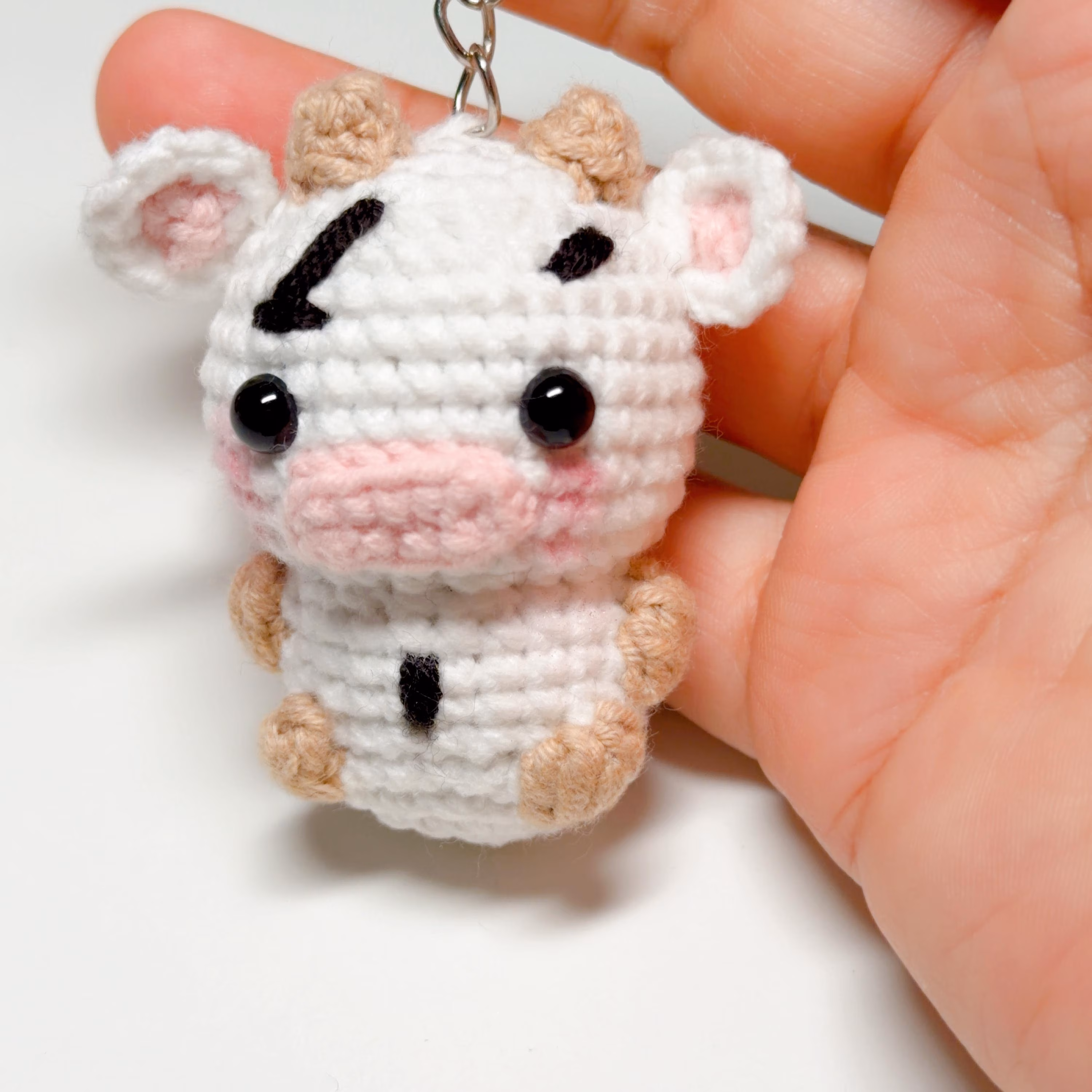 Black & White Crochet Cow Keychain, product photo 3