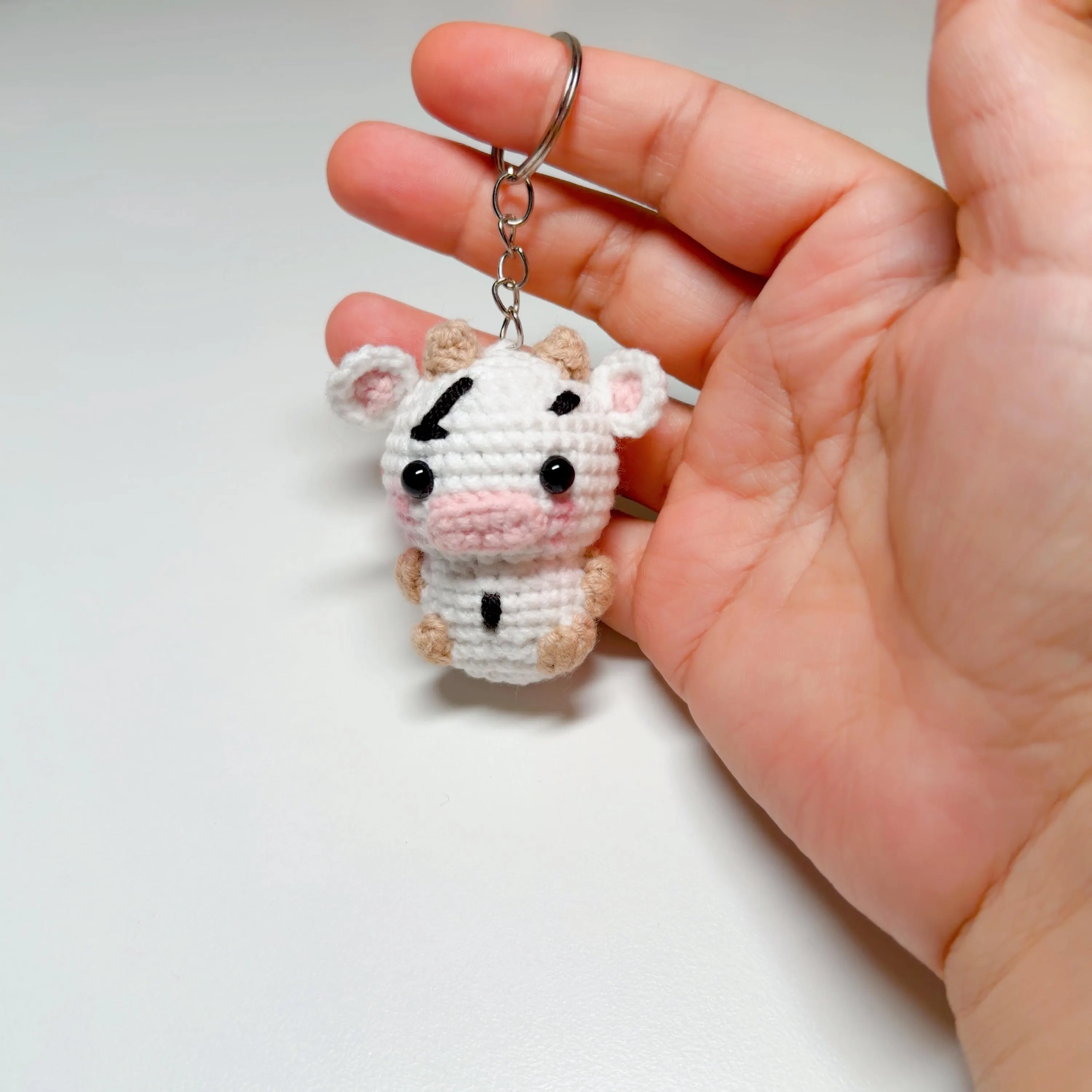 Black & White Crochet Cow Keychain, product photo 1